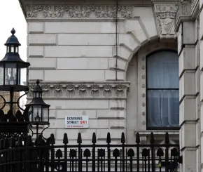 Street sign reading “Downing Street”